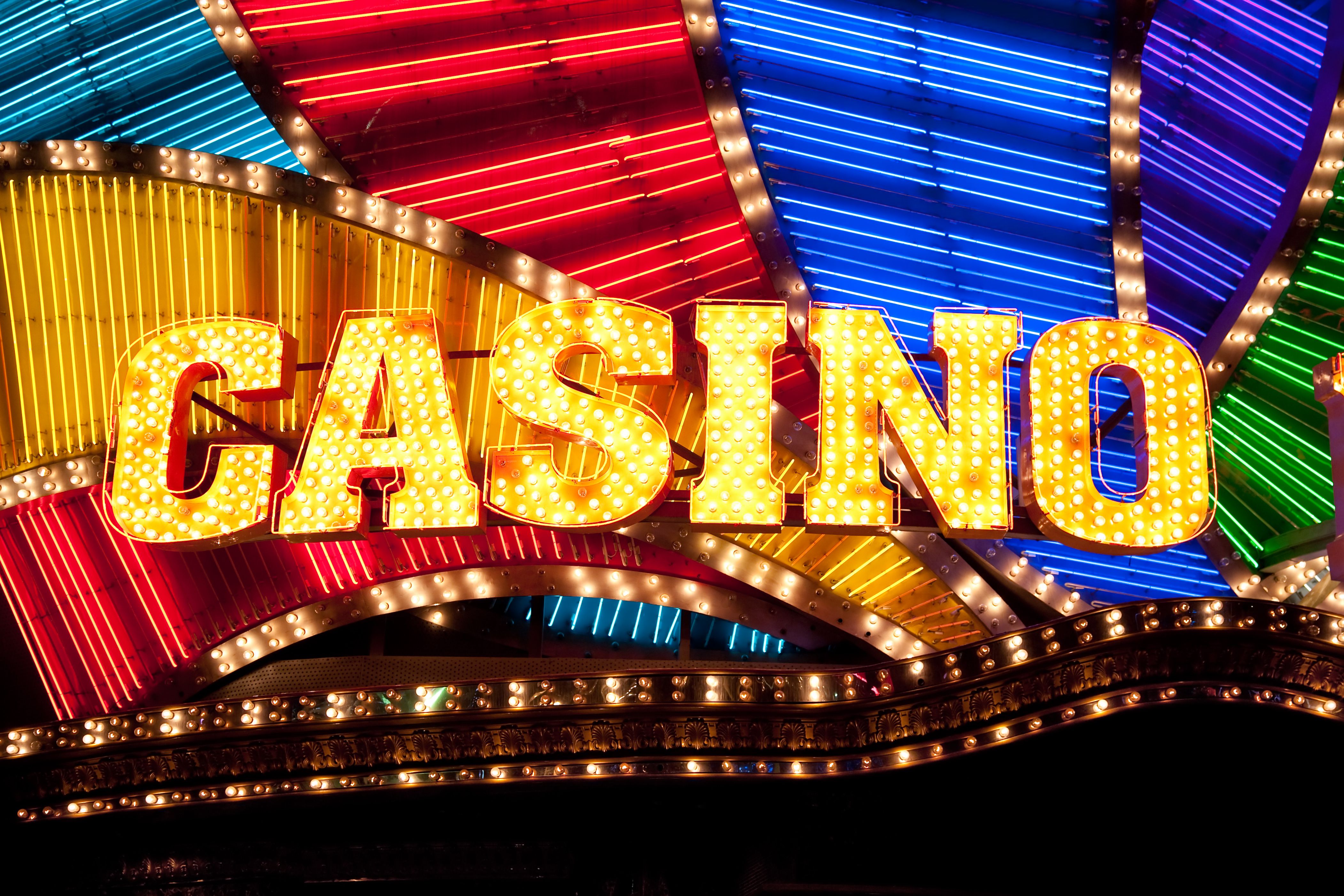 A dynamic, close-up shot of various colorful casino chips.